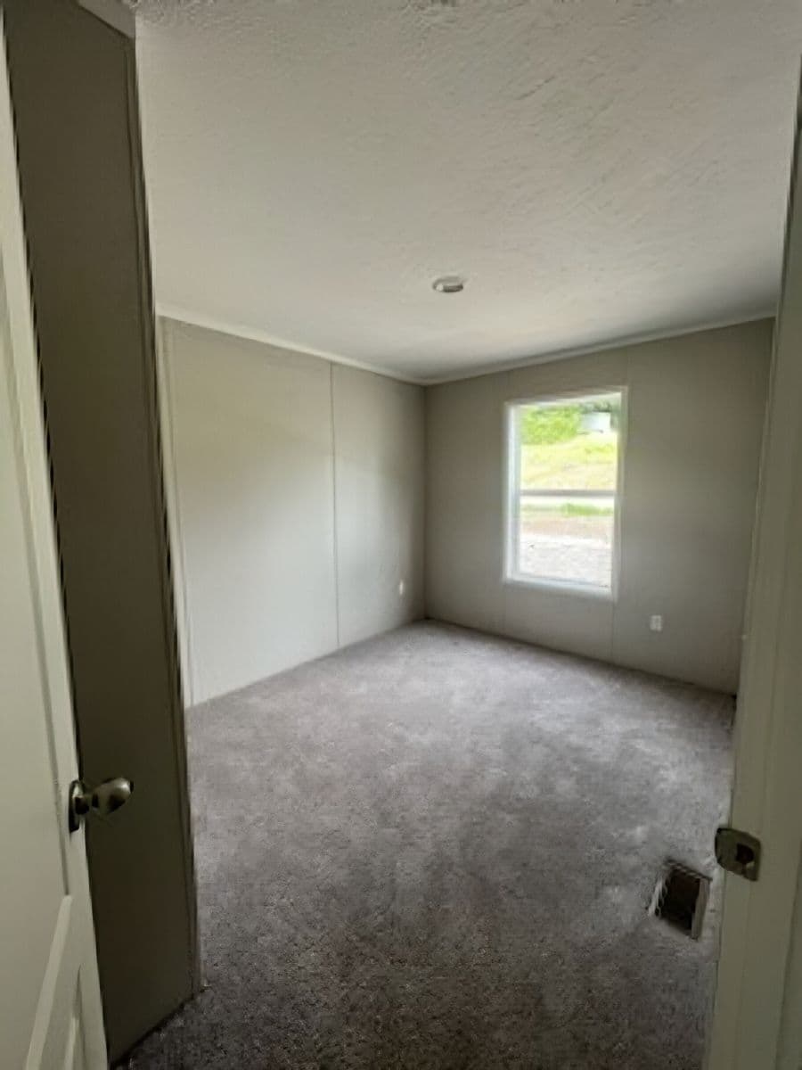 The JADE 40 Bedroom. This Manufactured Mobile Home features 2 bedrooms and 2 baths.
