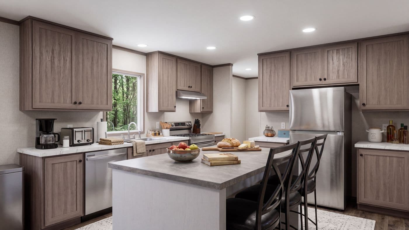 The THE MOUNTAINEER 60 Kitchen. This Manufactured Mobile Home features 3 bedrooms and 2 baths.