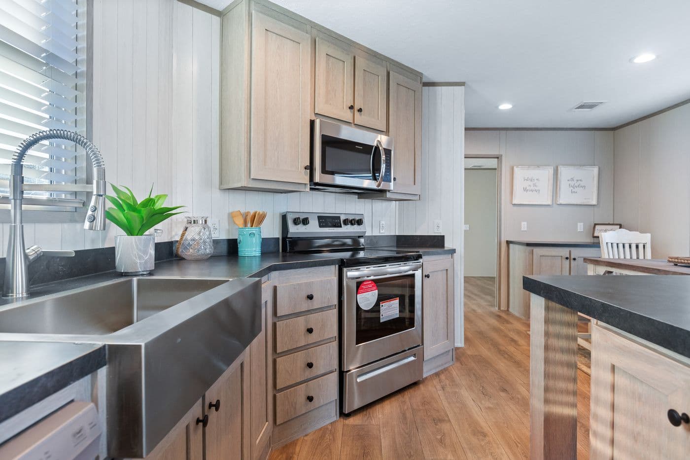 The RESOLUTION 16763J Kitchen. This Manufactured Mobile Home features 3 bedrooms and 2 baths.
