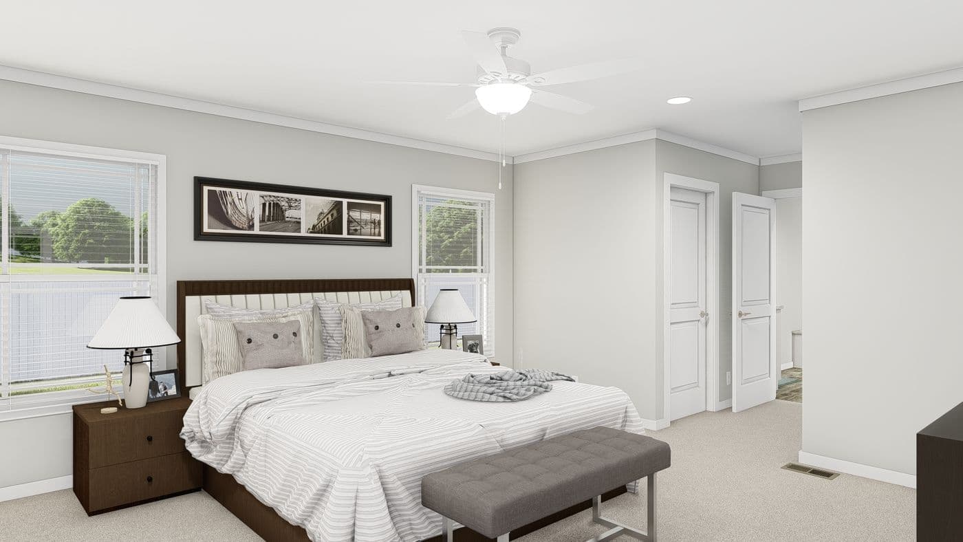 The FRONTIER Primary Bedroom. This Manufactured Mobile Home features 3 bedrooms and 2 baths.