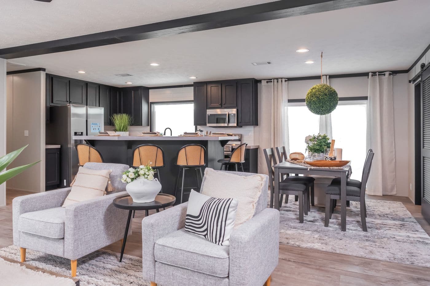 The CRAZY EIGHTS Living Room. This Manufactured Mobile Home features 4 bedrooms and 2 baths.