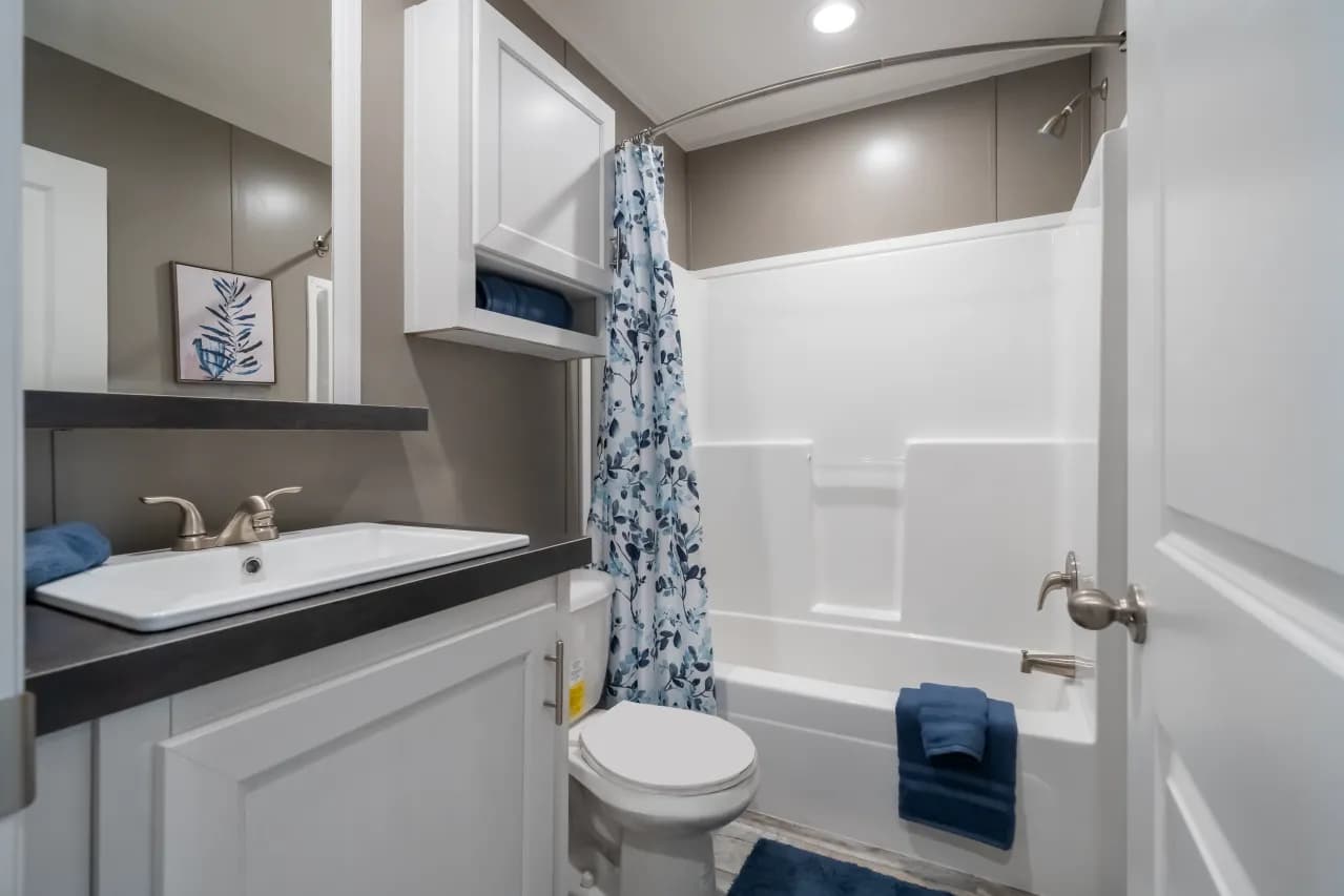 The LIBERTY Guest Bathroom. This Manufactured Mobile Home features 3 bedrooms and 2 baths.