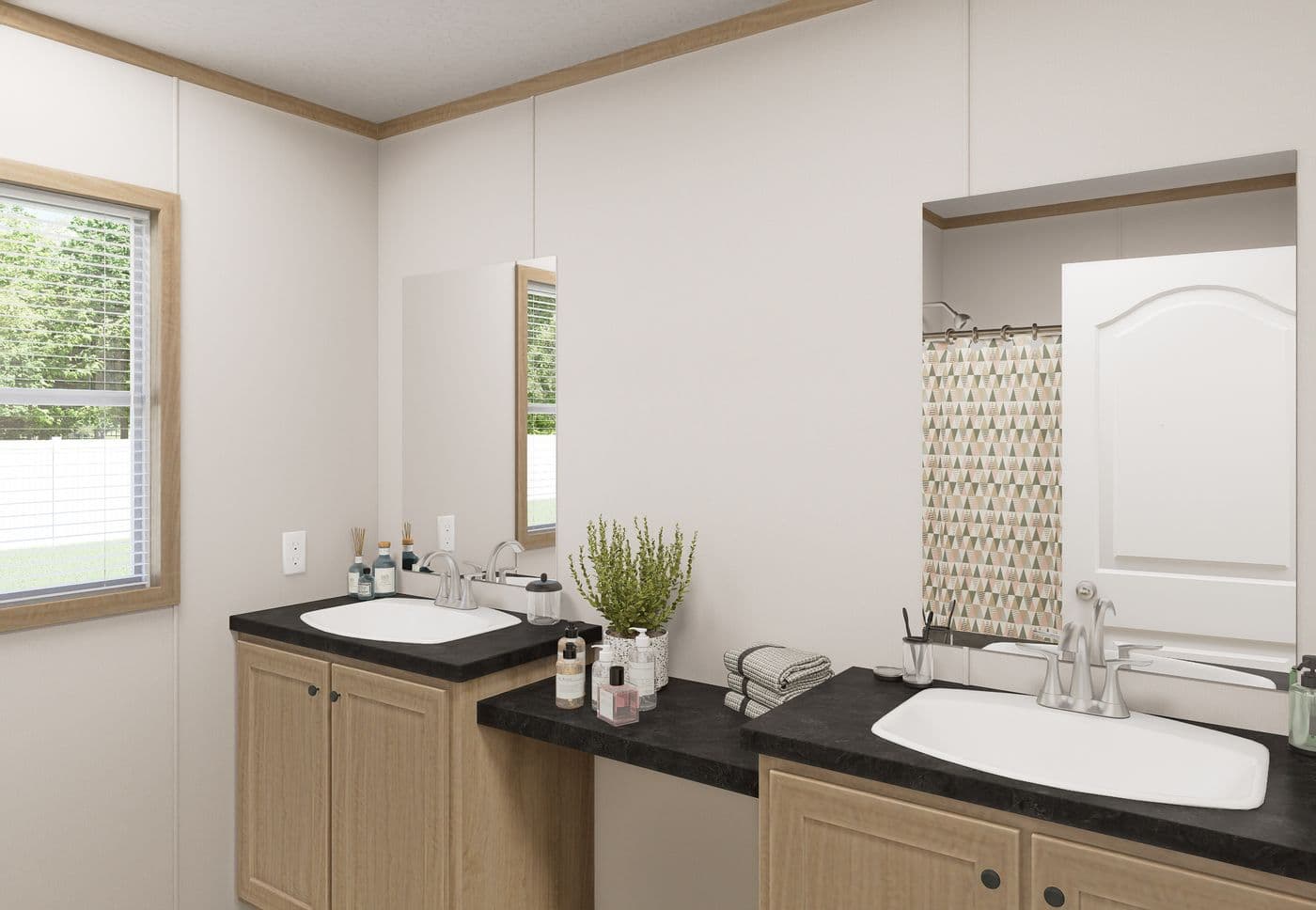 The THE MOUNTAINEER 72 Guest Bathroom. This Manufactured Mobile Home features 3 bedrooms and 2 baths.