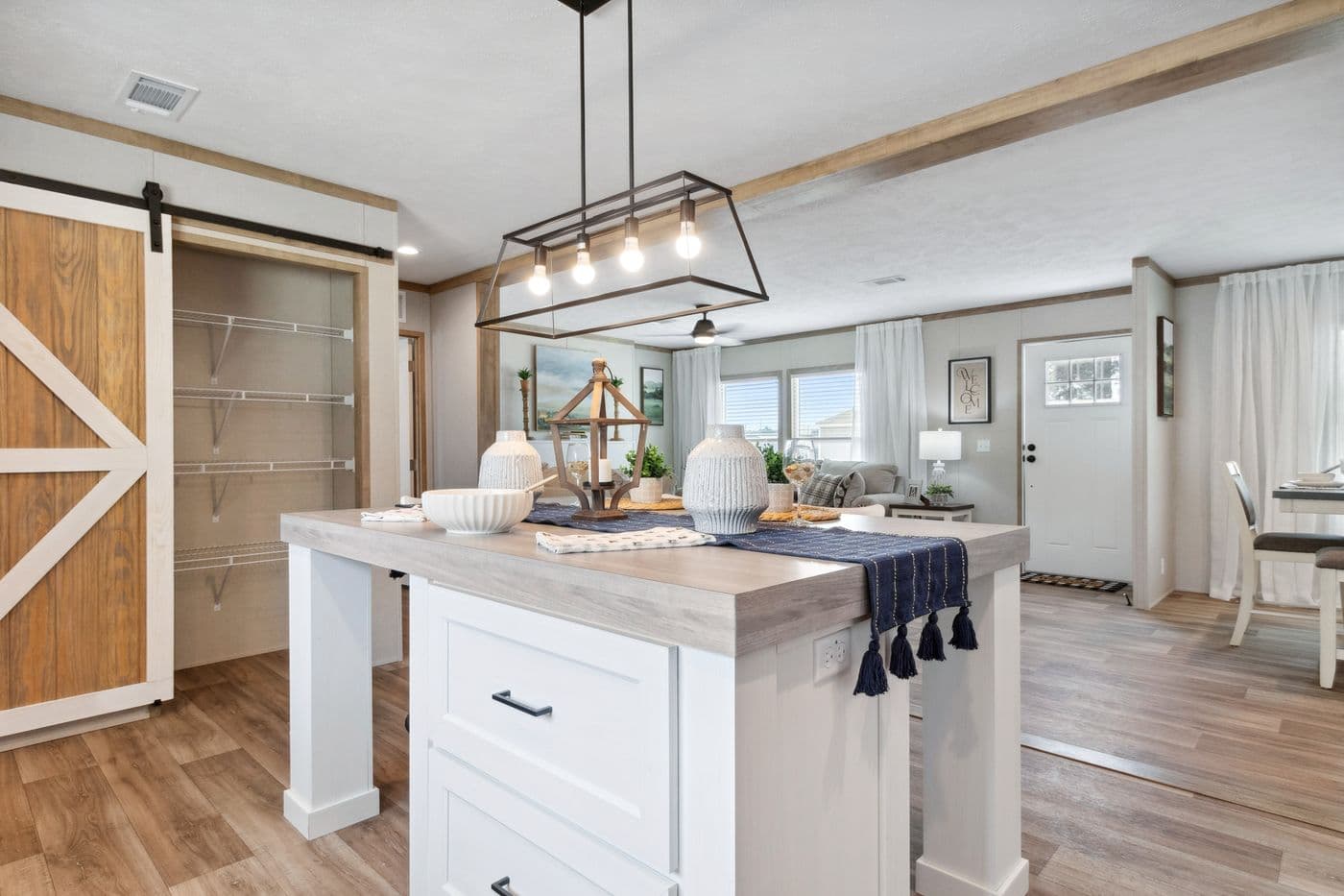 The BREEZE FARMHOUSE 72 Kitchen. This Manufactured Mobile Home features 4 bedrooms and 2 baths.
