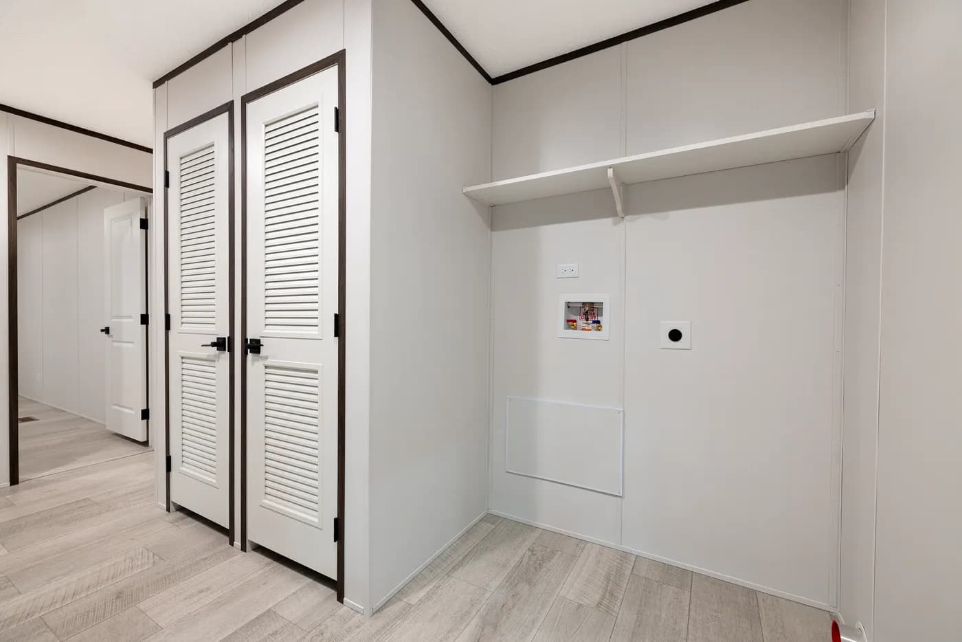 The CRESTWOOD Utility Room. This Manufactured Mobile Home features 3 bedrooms and 2 baths.