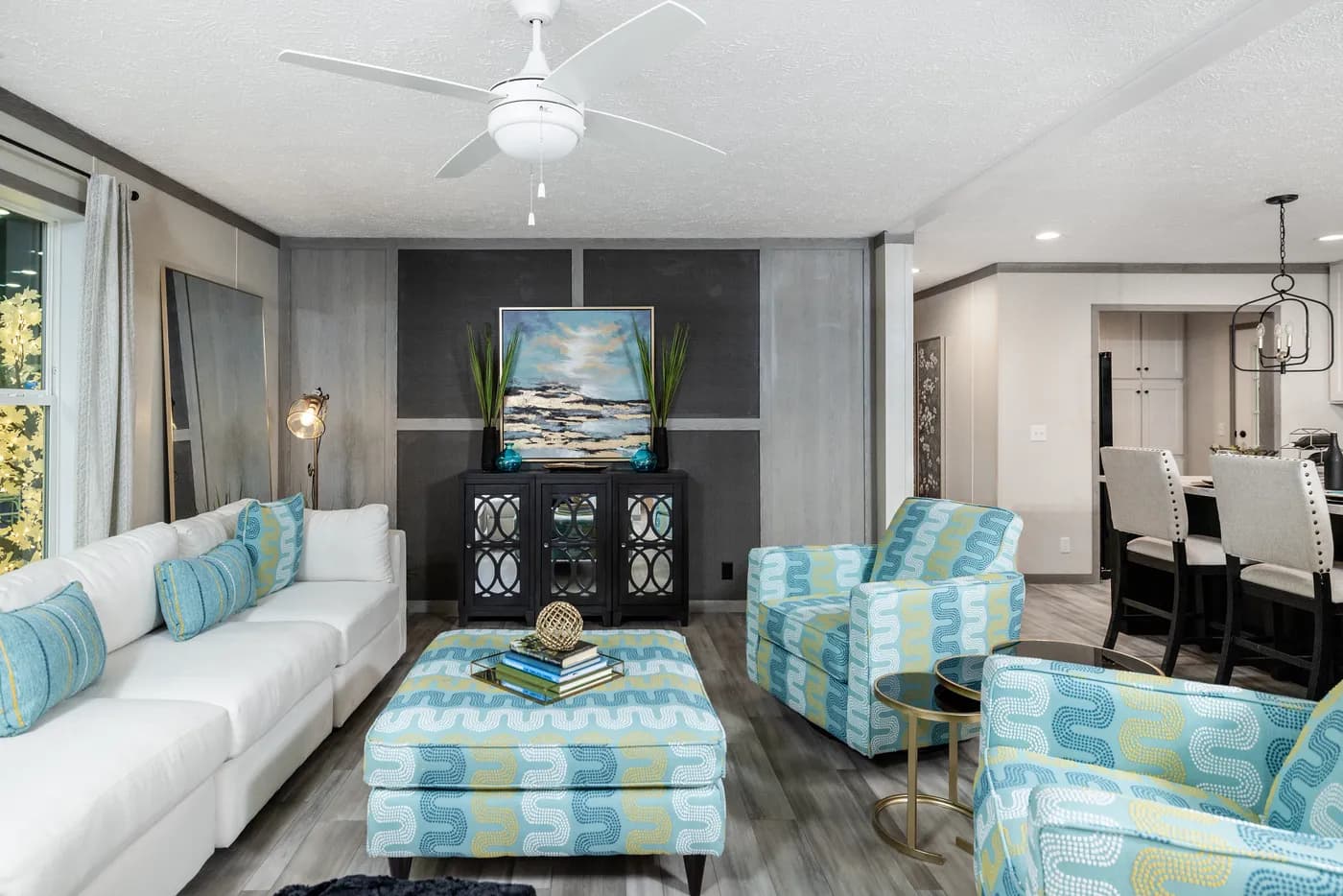 The 6428-E792 THE PULSE Living Room. This Manufactured Mobile Home features 3 bedrooms and 2.5 baths.