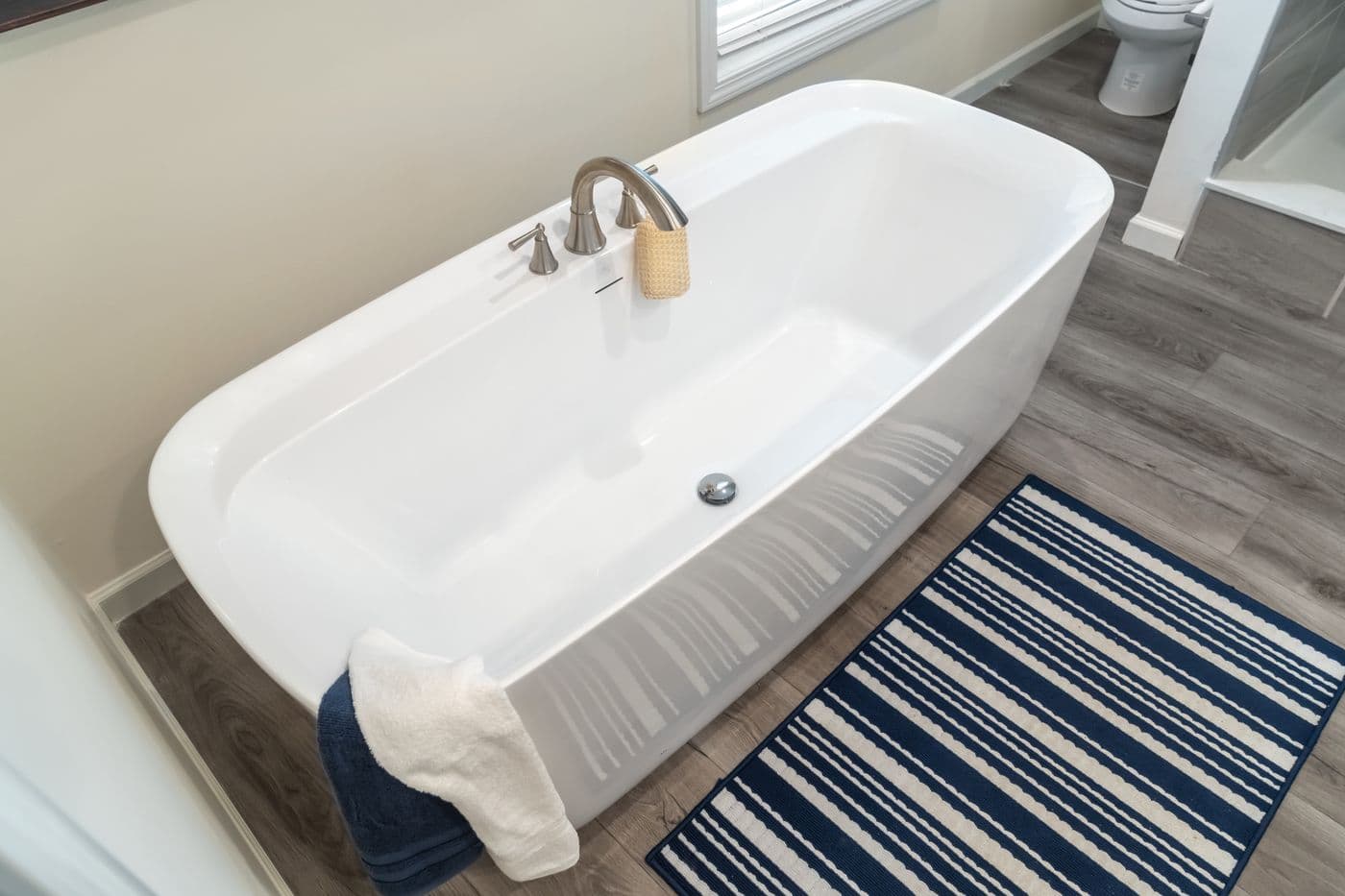 The 4220 "ATLANTIC" 7228 Primary Bathroom. This Manufactured Mobile Home features 3 bedrooms and 2 baths.