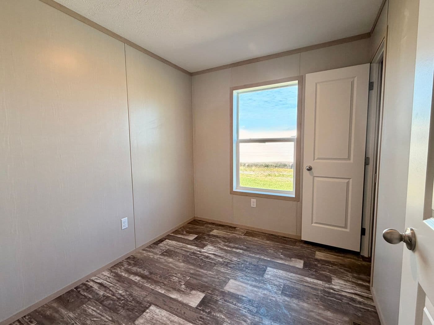 The JEFFERSON Guest Bedroom. This Manufactured Mobile Home features 3 bedrooms and 2 baths.