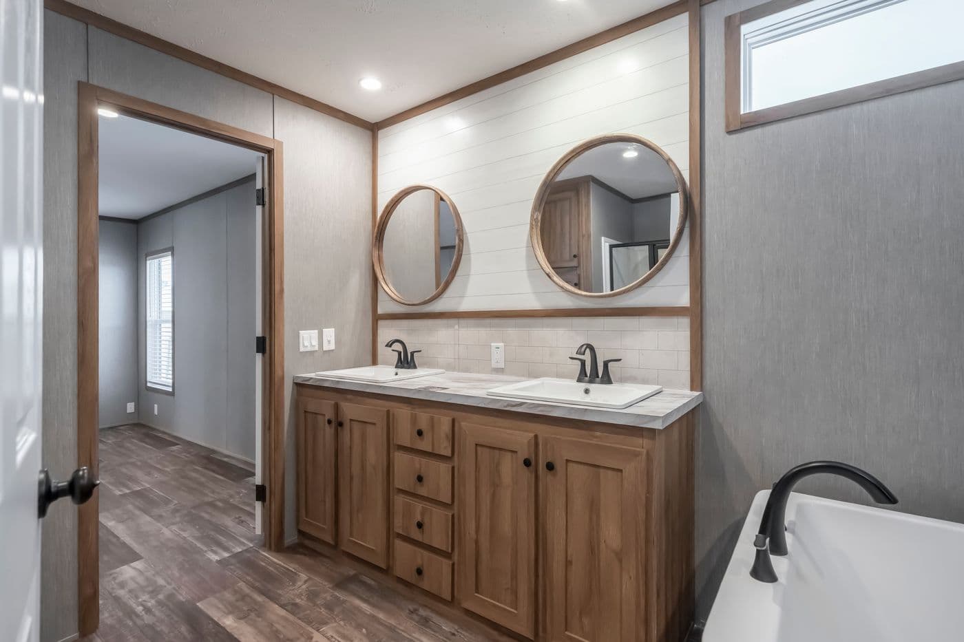 The BLACK DIAMOND Primary Bathroom. This Manufactured Mobile Home features 3 bedrooms and 2 baths.