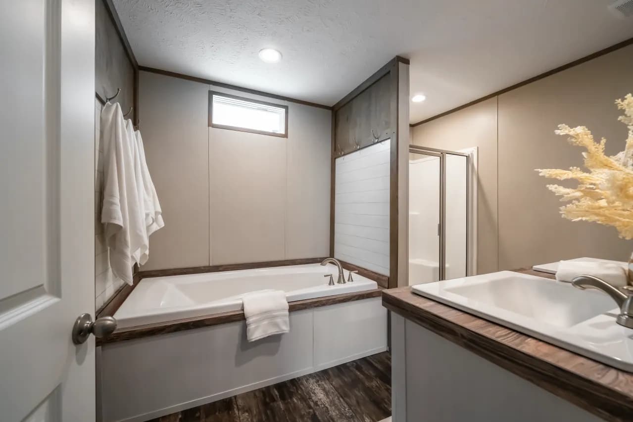 The ANNIVERSARY ENTERTAINER Exterior. This Manufactured Mobile Home features 3 bedrooms and 2 baths.