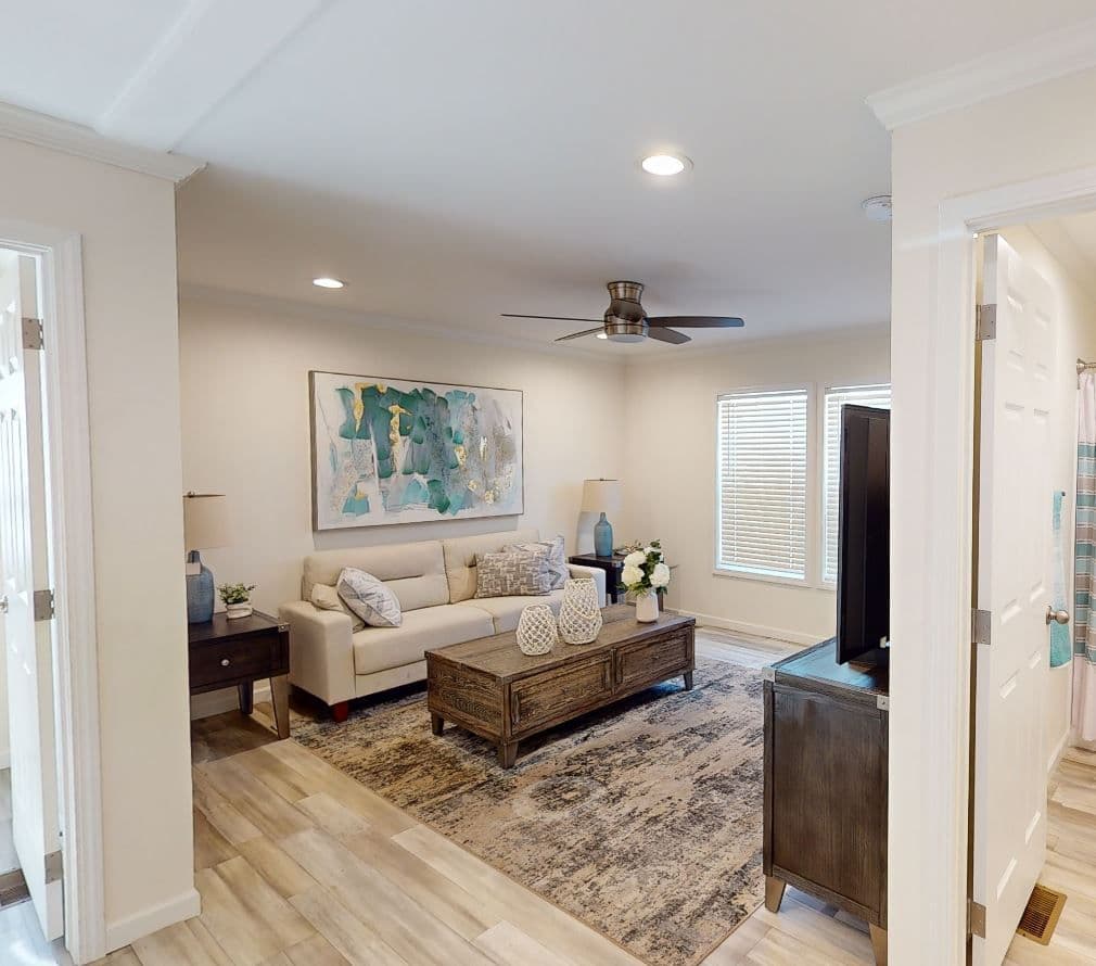 The 4215 "SUNRISE" 6428 Living Room. This Manufactured Mobile Home features 3 bedrooms and 2 baths.