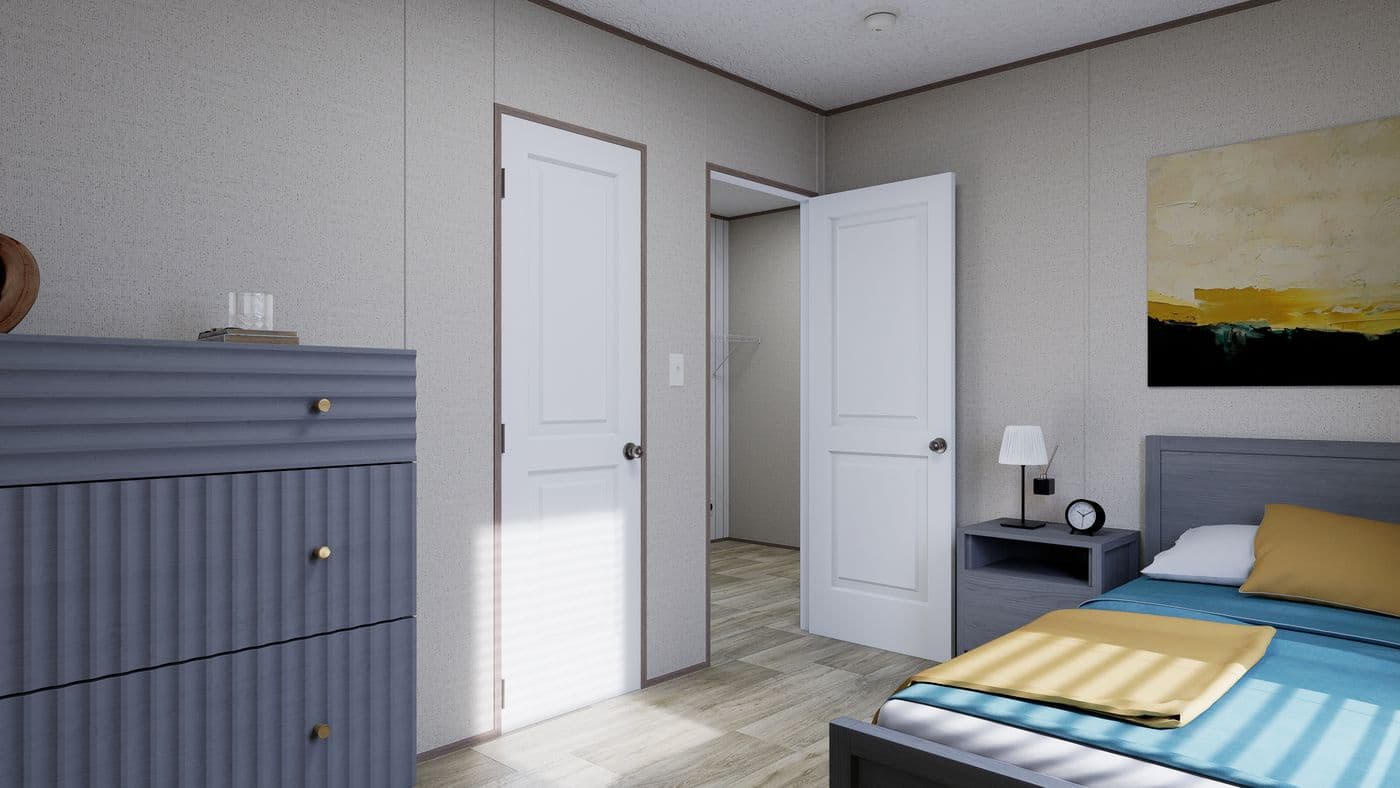 The FOOTHILLS 72 Guest Bedroom. This Manufactured Mobile Home features 3 bedrooms and 2 baths.