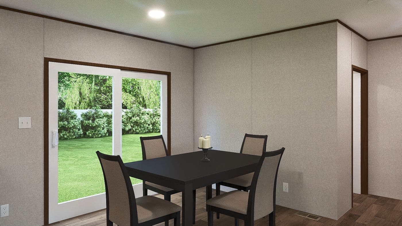 The SPRUCE Dining Area. This Manufactured Mobile Home features 3 bedrooms and 2 baths.