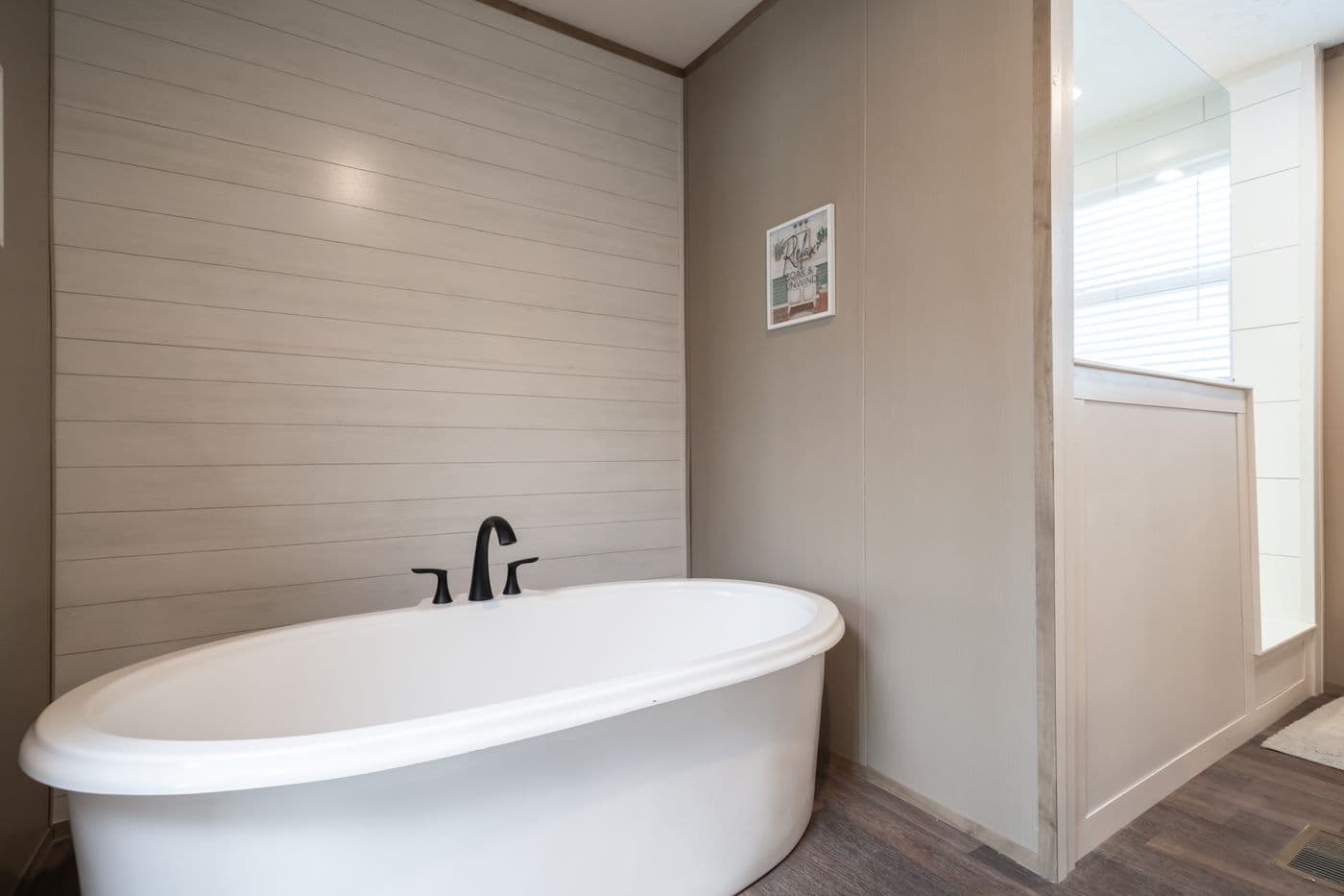The FARMHOUSE BREEZE 72 Primary Bathroom. This Manufactured Mobile Home features 4 bedrooms and 2 baths.