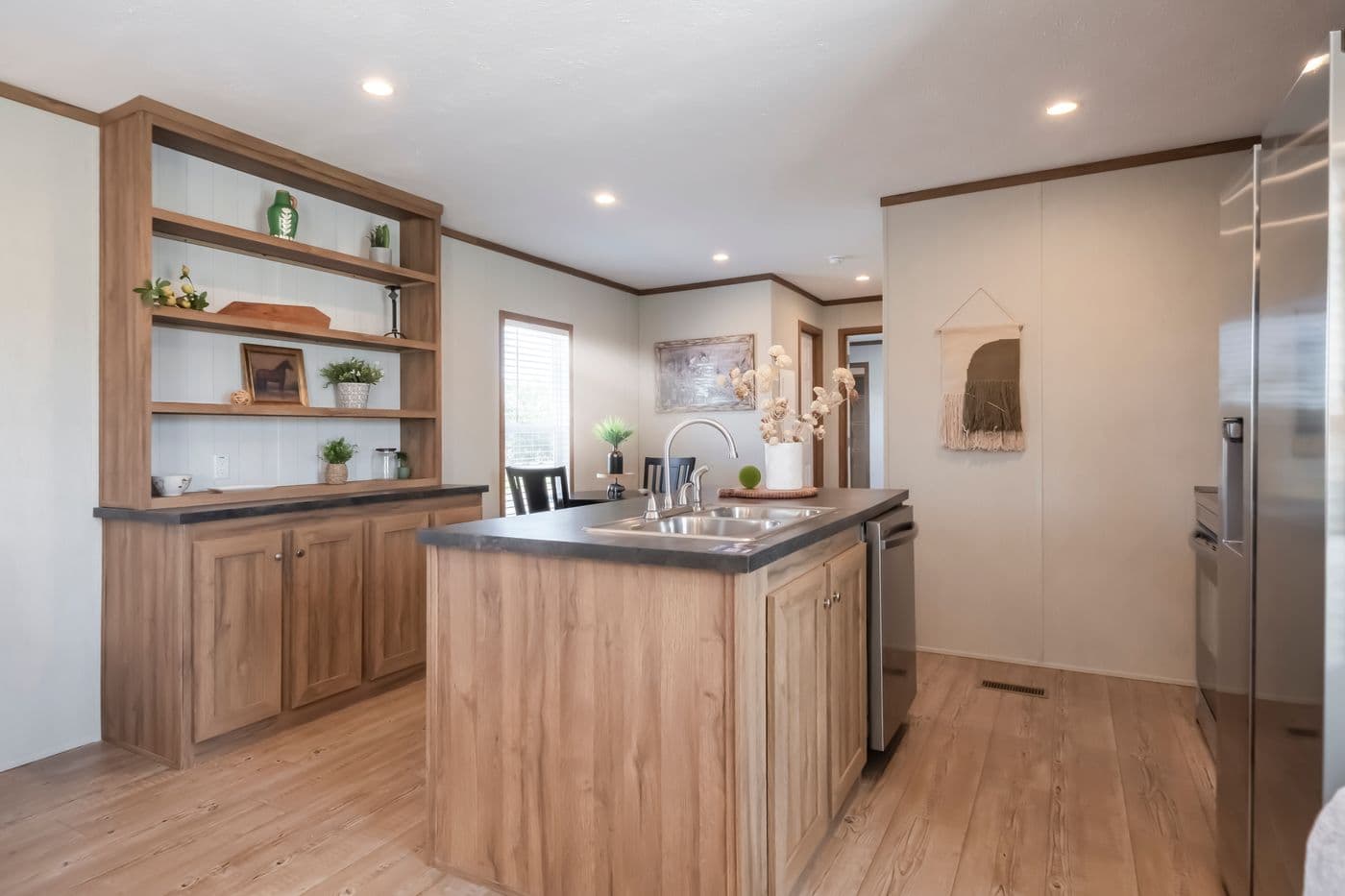 The SEAS THE DAY Kitchen. This Manufactured Mobile Home features 3 bedrooms and 2 baths.