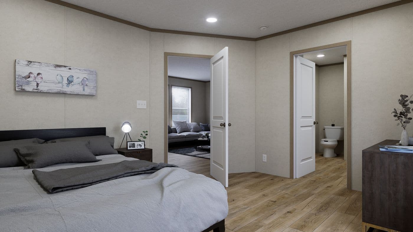 The 4824-CC54 OAKSTEAD 48 Primary Bedroom. This Manufactured Mobile Home features 3 bedrooms and 2 baths.