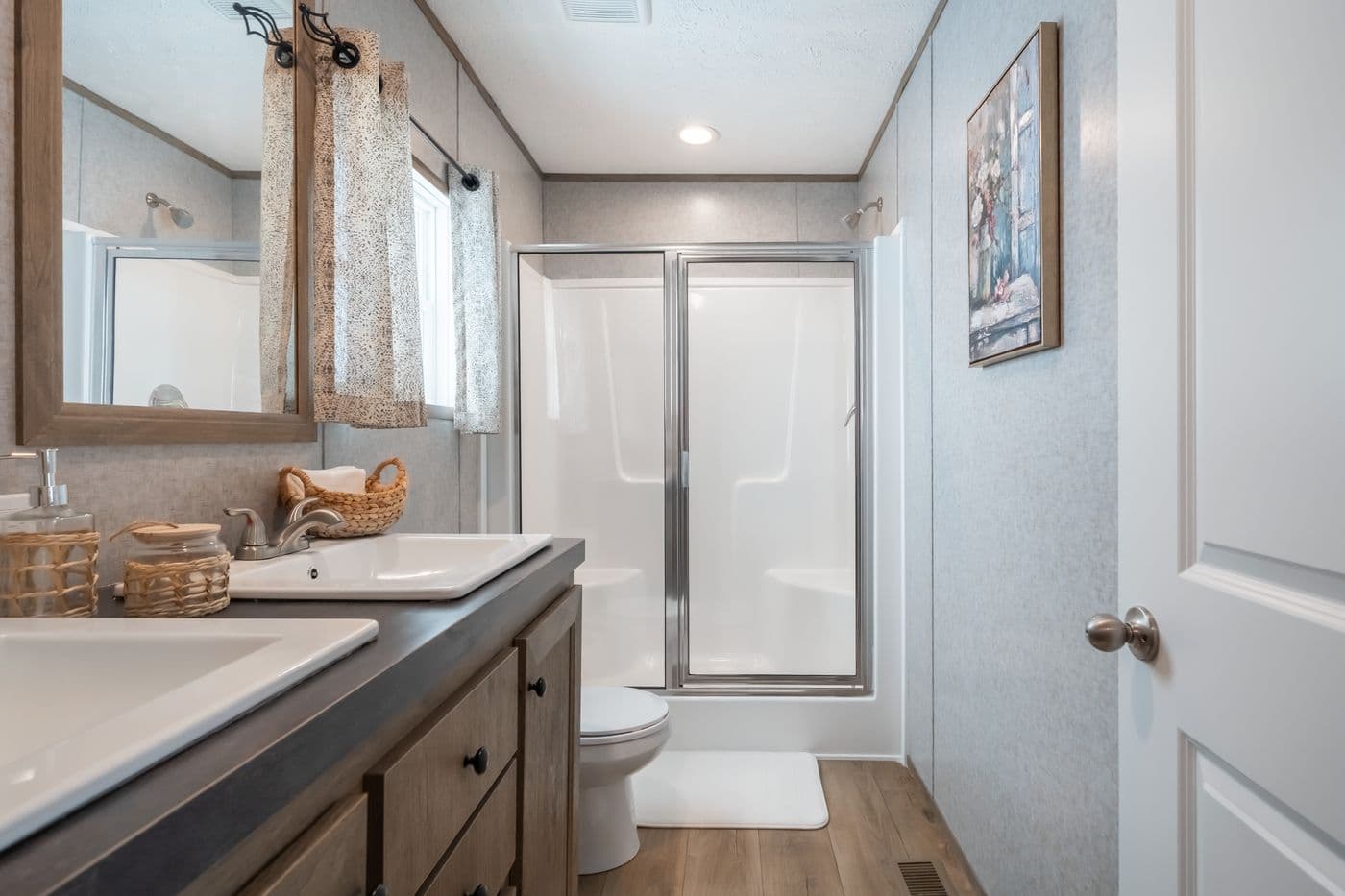 The WARRIOR II Primary Bathroom. This Manufactured Mobile Home features 2 bedrooms and 2 baths.