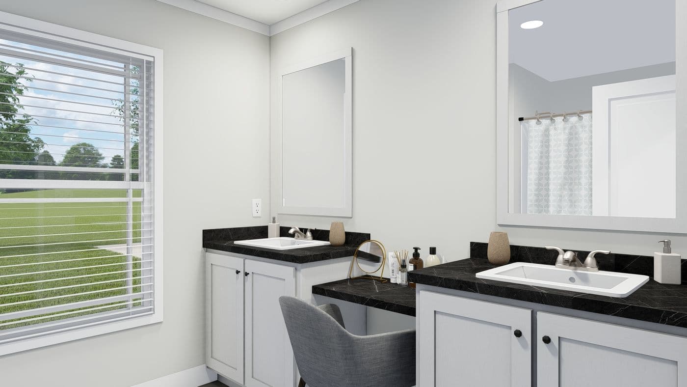 The THE BREEZE Guest Bathroom. This Manufactured Mobile Home features 3 bedrooms and 2 baths.
