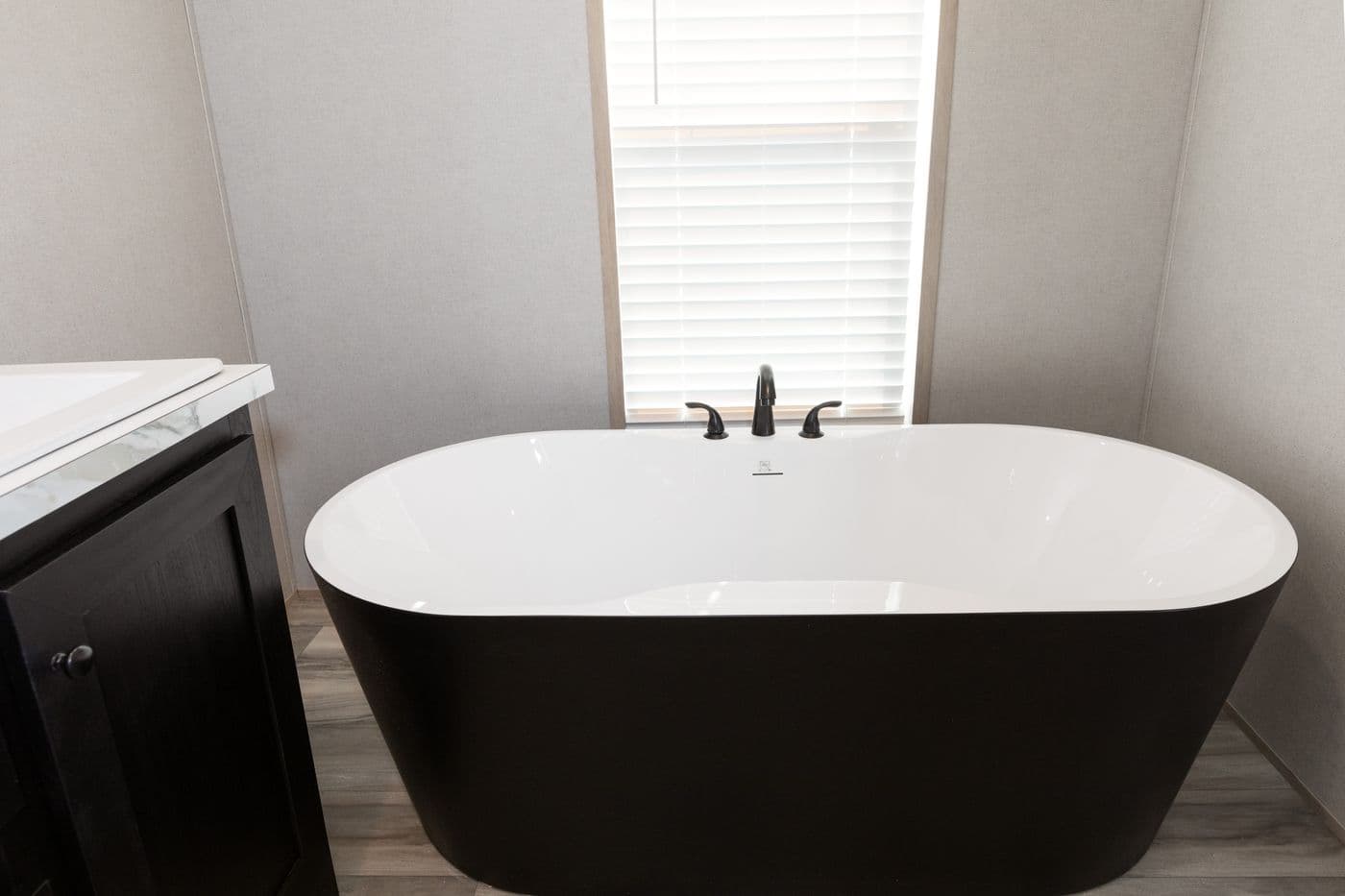 The THE ANNIVERSARY ISLANDER Primary Bathroom. This Manufactured Mobile Home features 3 bedrooms and 2 baths.