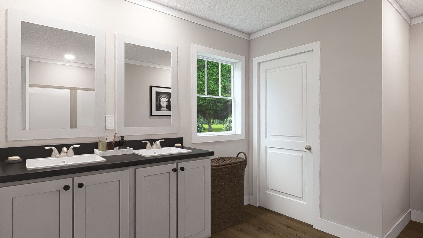 The WONDERFUL WORLD Primary Bathroom. This Manufactured Mobile Home features 3 bedrooms and 2 baths.