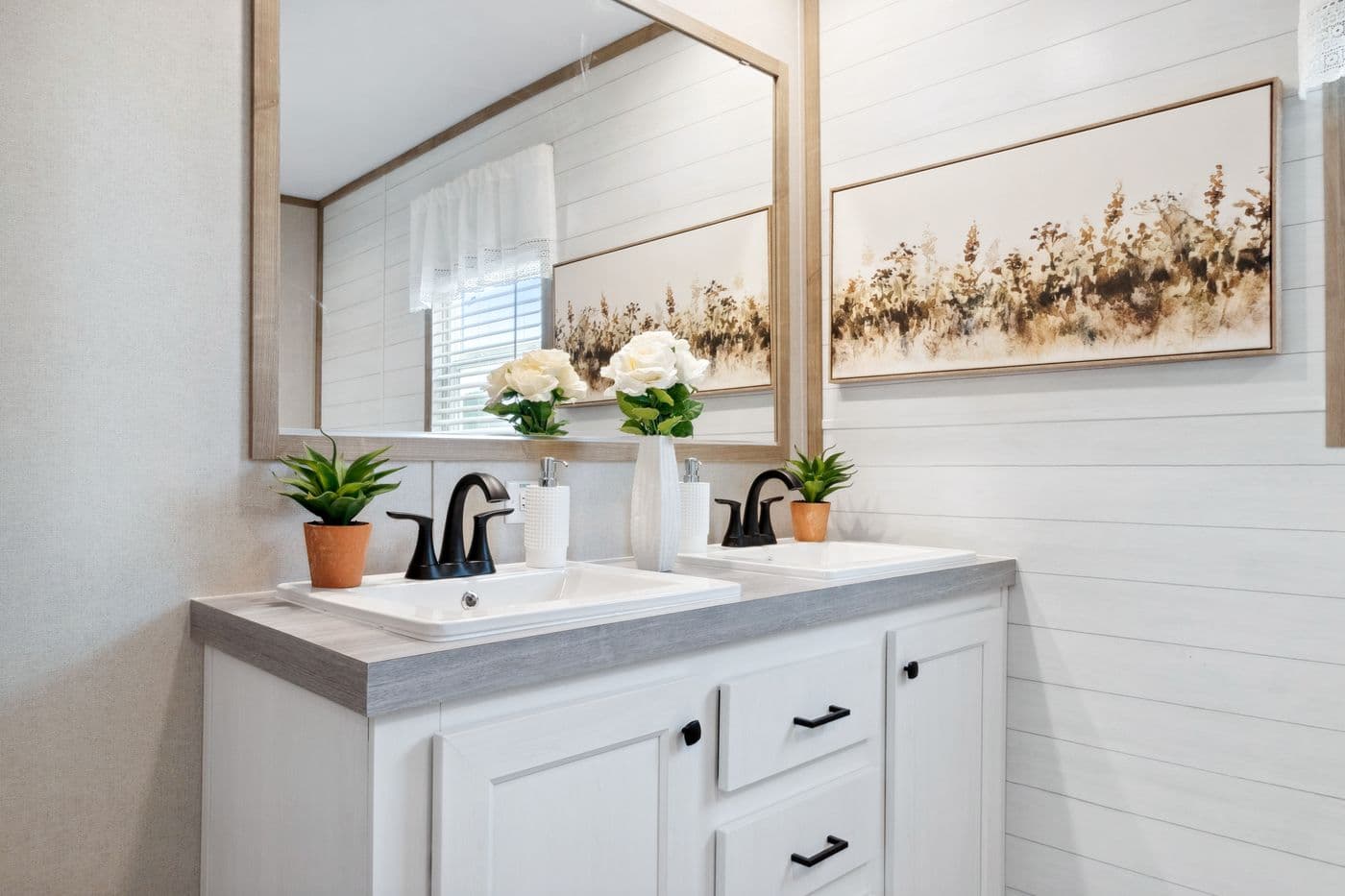 The BREEZE FARMHOUSE 72 Primary Bathroom. This Manufactured Mobile Home features 4 bedrooms and 2 baths.