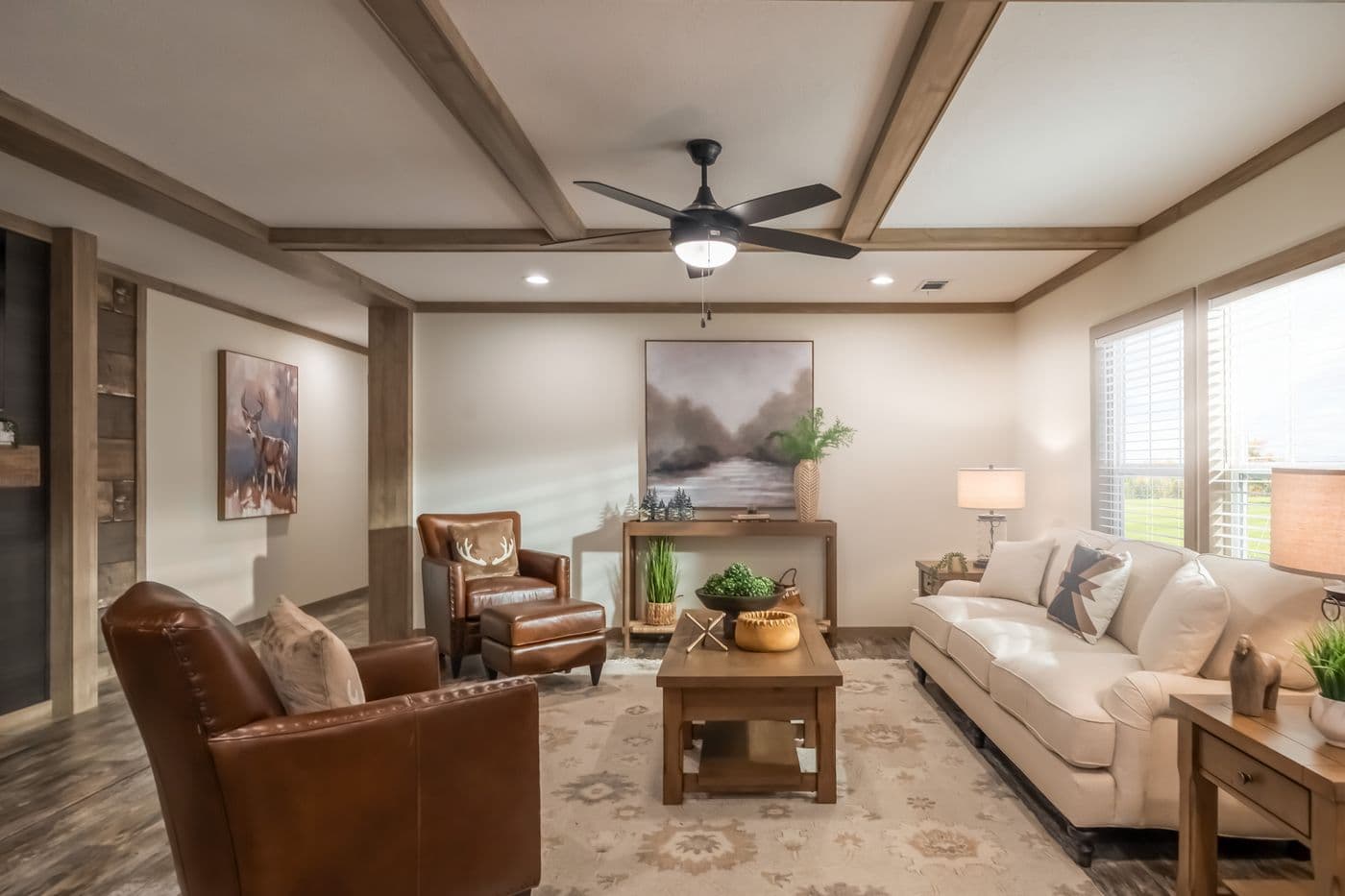 The BOUJEE PREMIER Living Room. This Manufactured Mobile Home features 4 bedrooms and 2 baths.