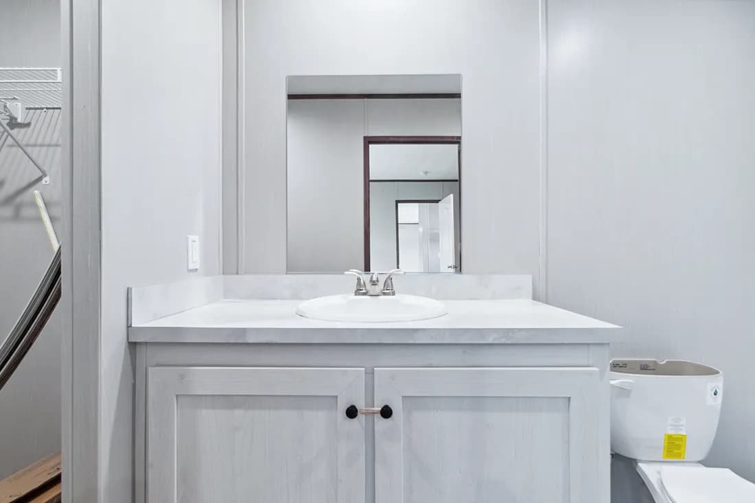 The HOMESTEAD 16562A Primary Bathroom. This Manufactured Mobile Home features 2 bedrooms and 2 baths.