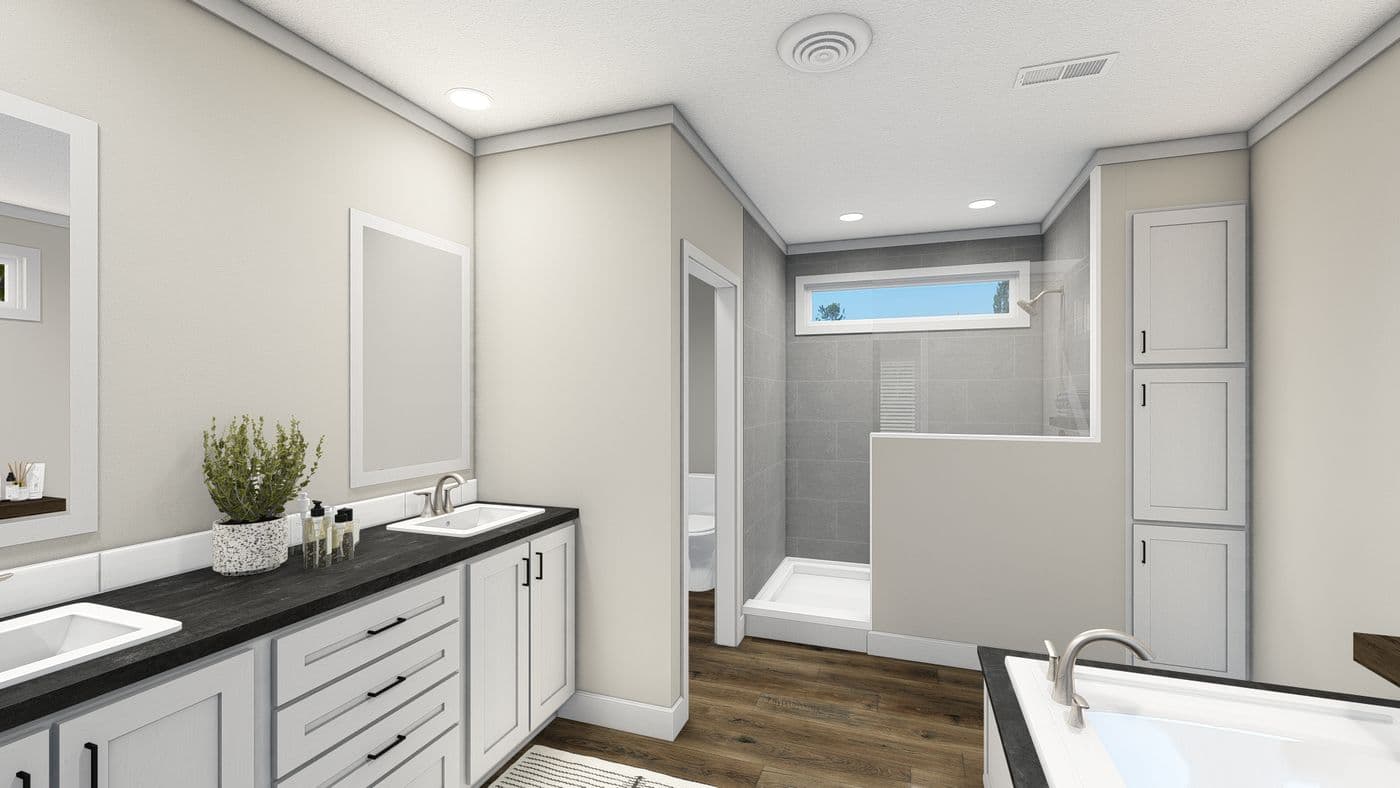 The THE DENALI Primary Bathroom. This Manufactured Mobile Home features 3 bedrooms and 2 baths.