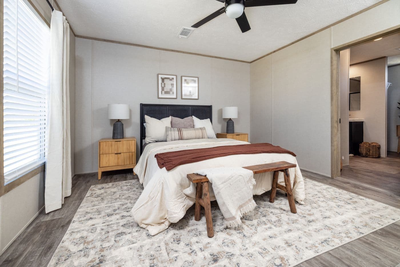The STERLING ANNIVERSARY Primary Bedroom. This Manufactured Mobile Home features 3 bedrooms and 2 baths.