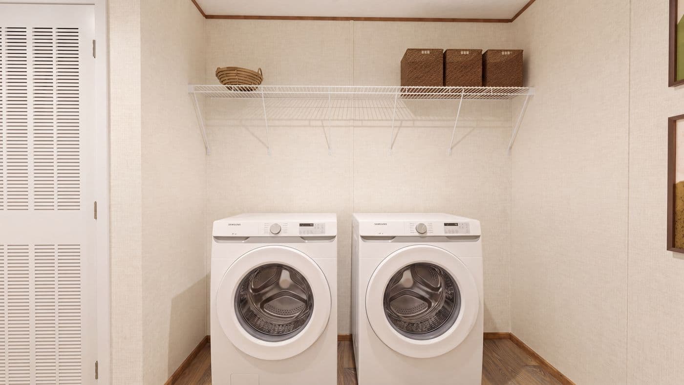 The REDWOOD Utility Room. This Manufactured Mobile Home features 5 bedrooms and 3 baths.