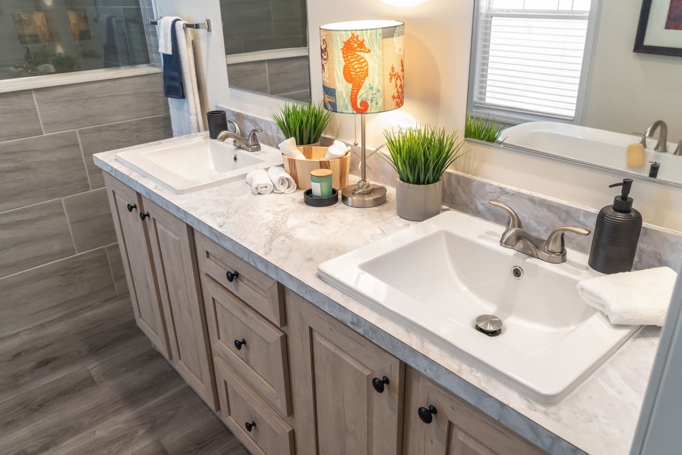 The 4220 "ATLANTIC" 7228 Primary Bathroom. This Manufactured Mobile Home features 3 bedrooms and 2 baths.