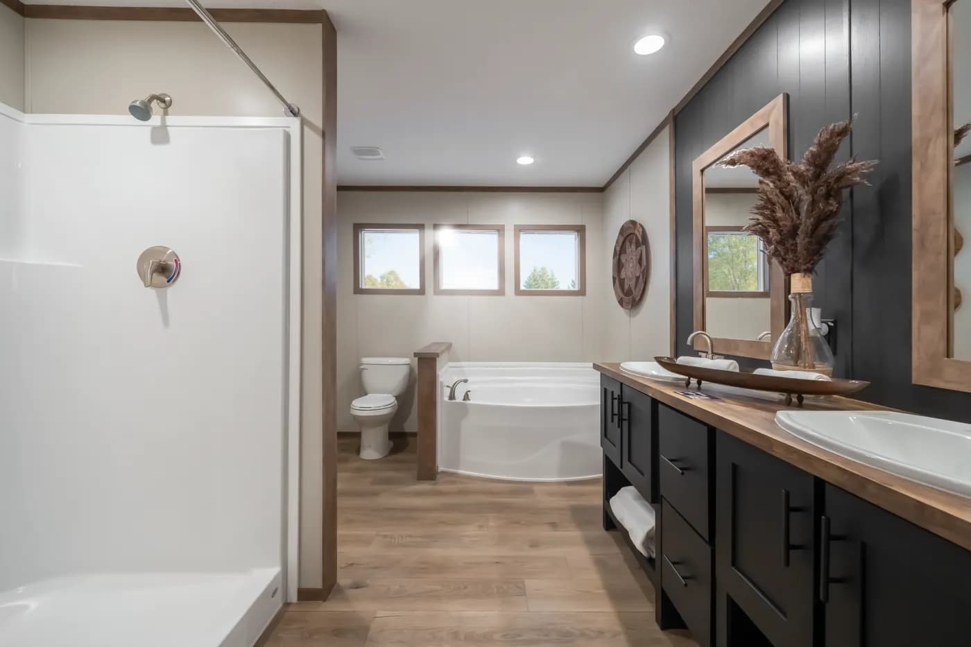 The SEVIER Primary Bathroom. This Manufactured Mobile Home features 4 bedrooms and 3 baths.