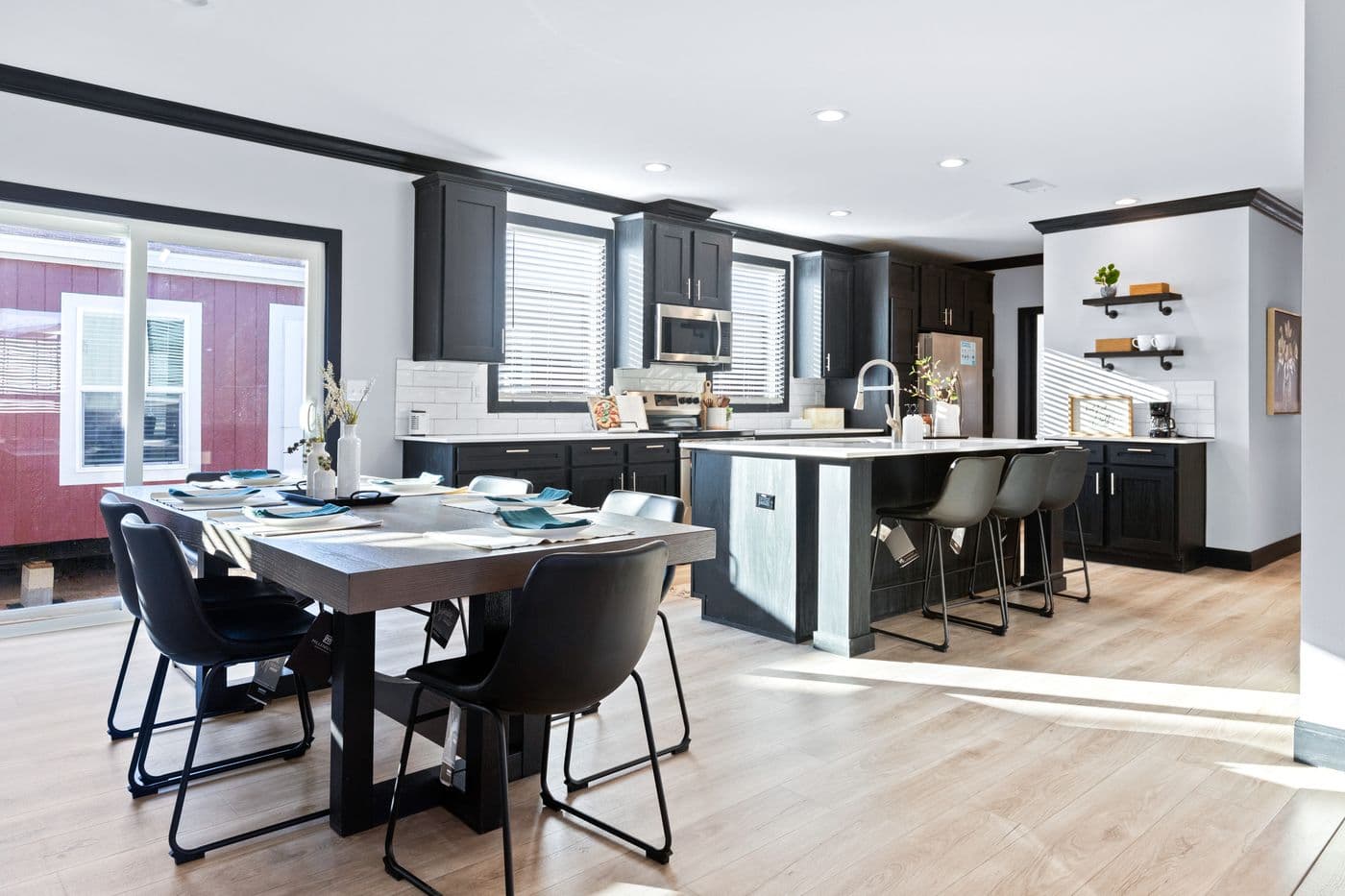 The THE LOUIS Dining Room. This Manufactured Mobile Home features 4 bedrooms and 3 baths.