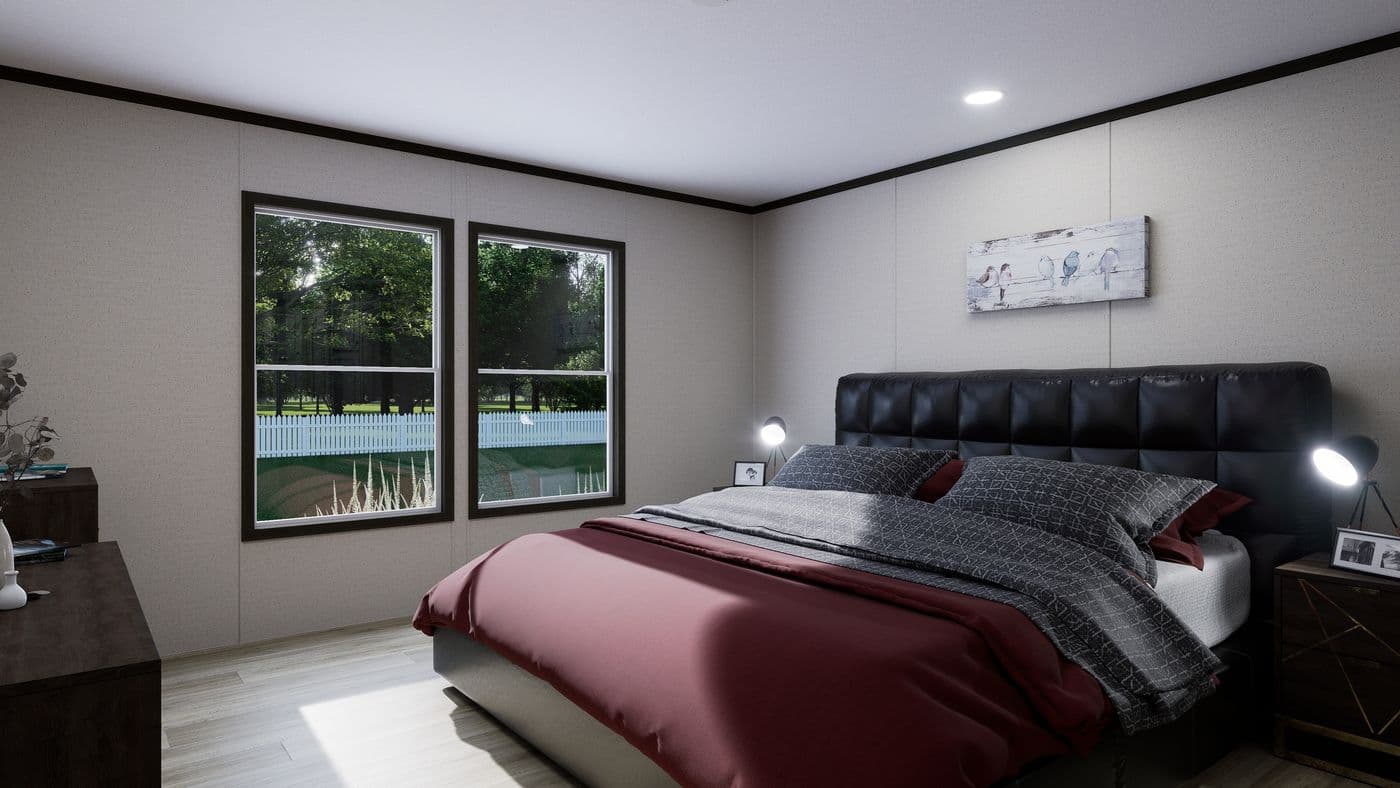 The THE PURPOSE Primary Bedroom. This Manufactured Mobile Home features 4 bedrooms and 2 baths.