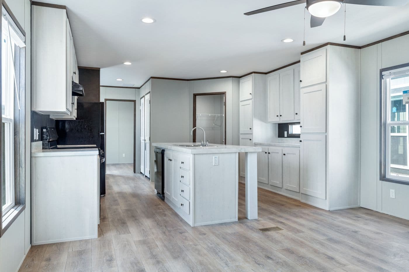 The SELECT 16602S Kitchen. This Manufactured Mobile Home features 2 bedrooms and 2 baths.