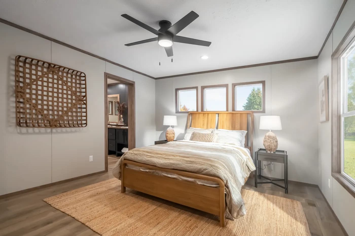 The SEVIER Primary Bedroom. This Manufactured Mobile Home features 4 bedrooms and 3 baths.