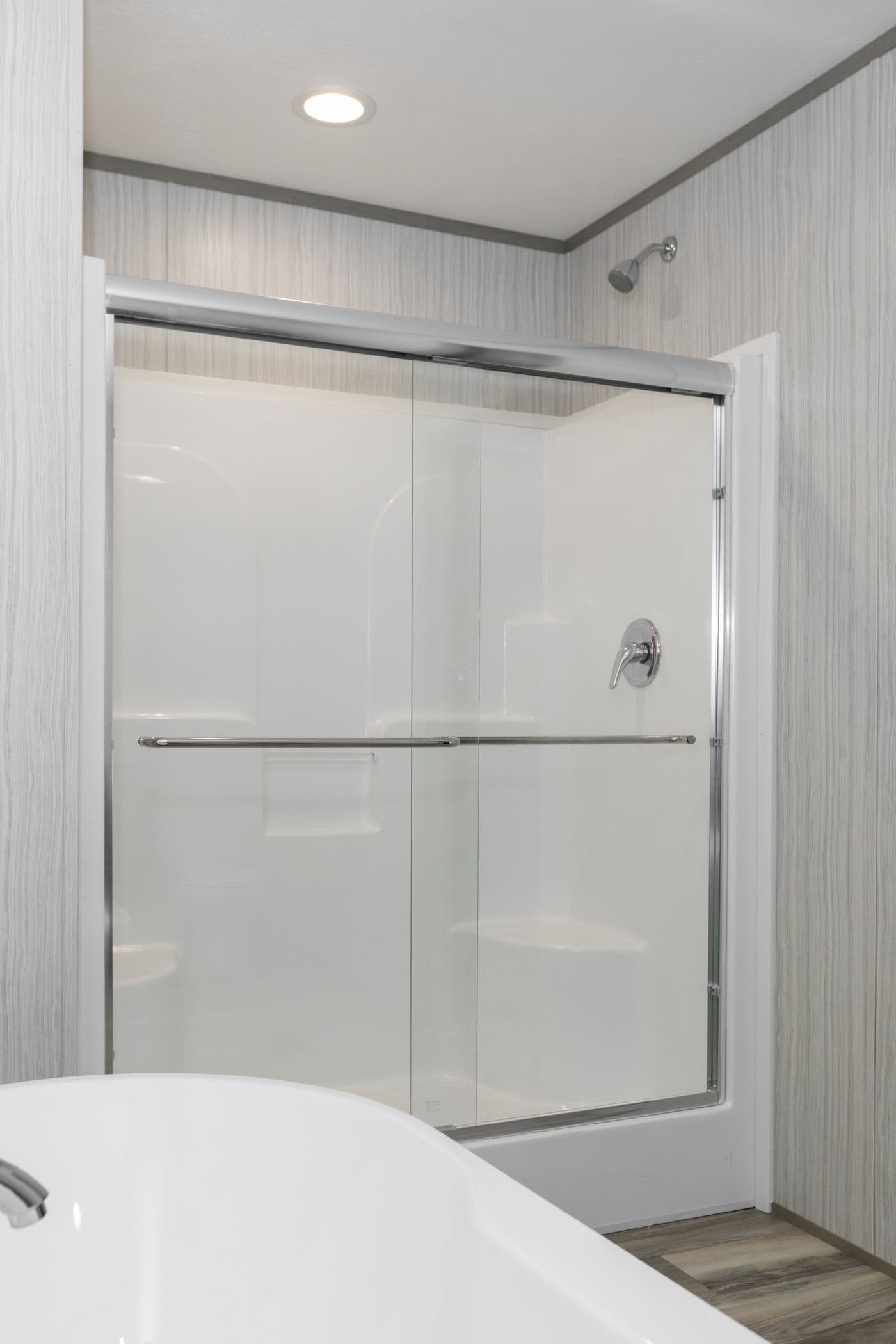 The THE OLYMPUS Primary Bathroom. This Manufactured Mobile Home features 3 bedrooms and 2 baths.