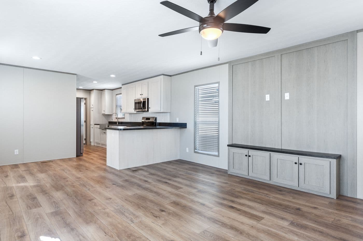 The RESOLUTION 16763K Living Room. This Manufactured Mobile Home features 3 bedrooms and 2 baths.