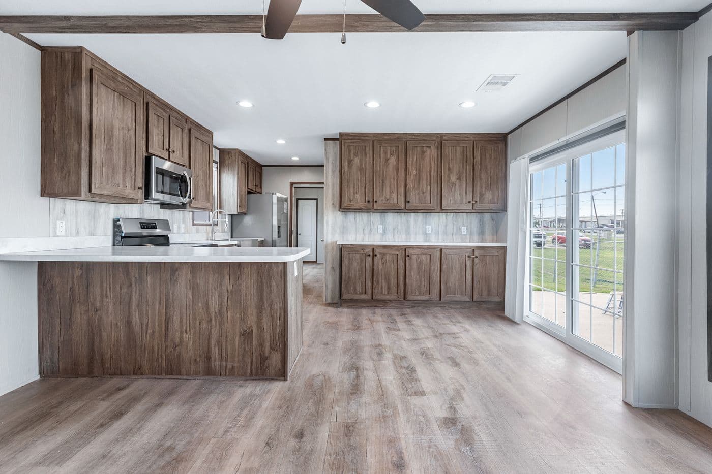 The ANNIVERSARY 16683B Living Room. This Manufactured Mobile Home features 3 bedrooms and 2 baths.