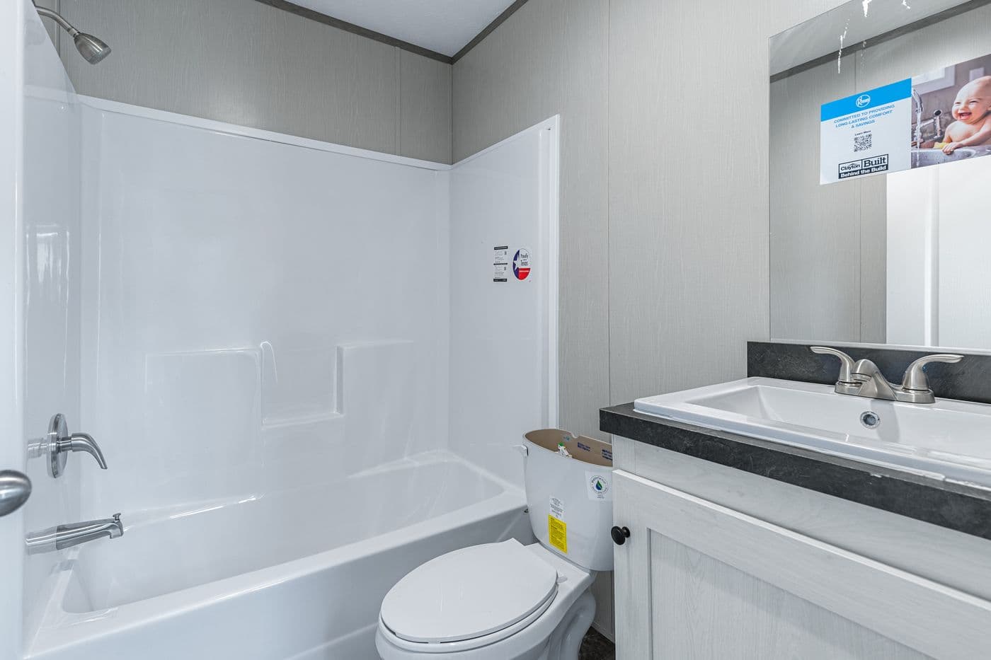 The RESOLUTION 16763H Guest Bathroom. This Manufactured Mobile Home features 3 bedrooms and 2 baths.