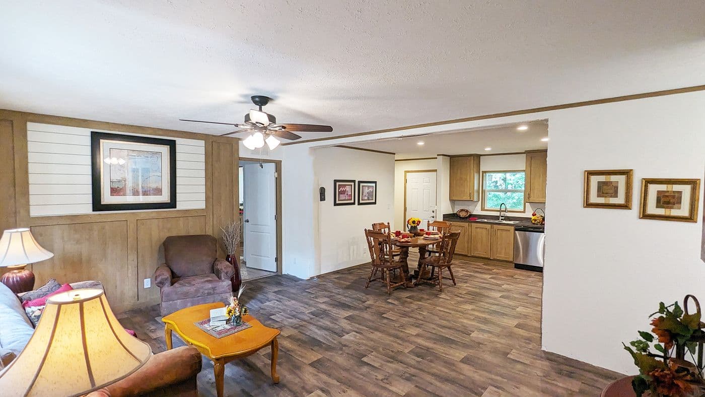 The LIFESTYLE 65-2 Living Room. This Manufactured Mobile Home features 3 bedrooms and 2 baths.