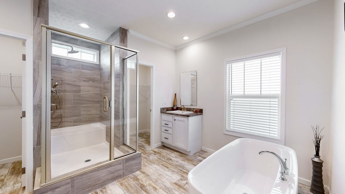 The 4872 ENTERPRISE 32X76 MODULAR Primary Bathroom. This Modular Home features 4 bedrooms and 2 baths.