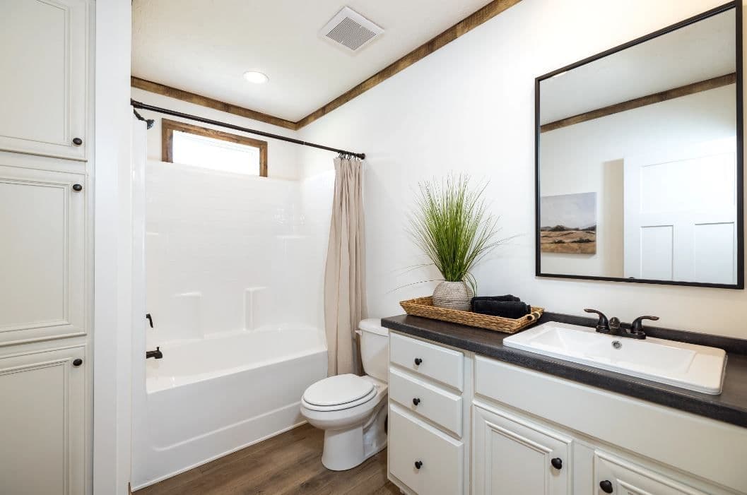 The ARABELLA Guest Bathroom. This Manufactured Mobile Home features 3 bedrooms and 2 baths.
