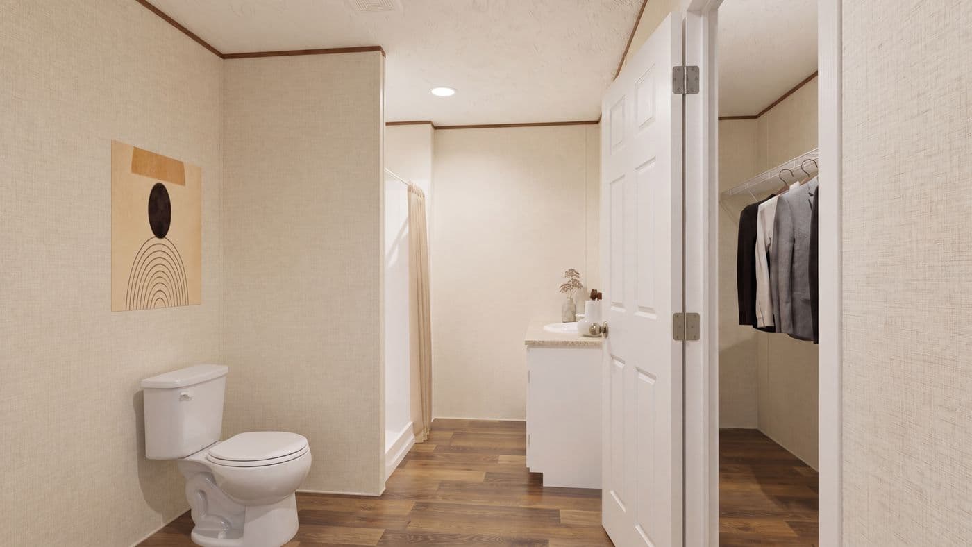 The SPRUCE Primary Bathroom. This Manufactured Mobile Home features 3 bedrooms and 2 baths.