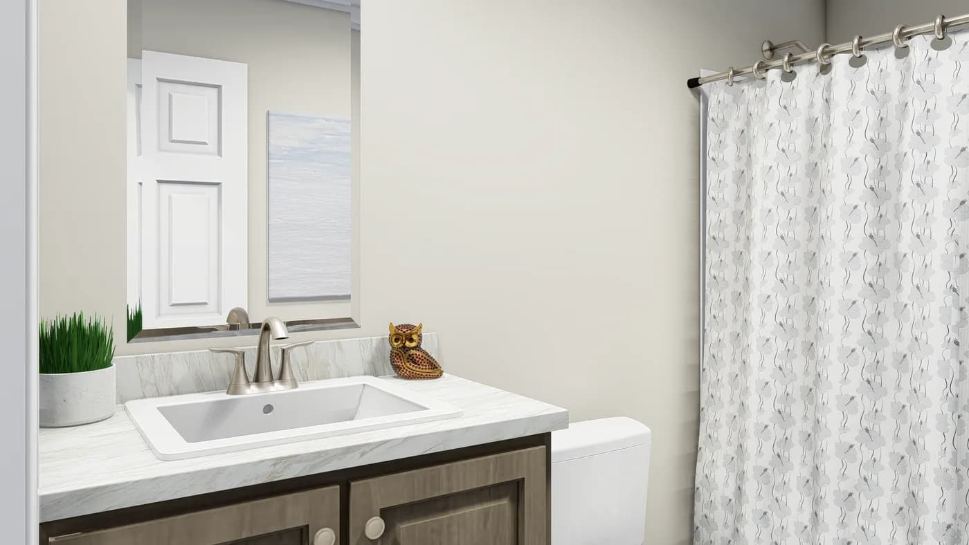 The CAROLINIAN M5010 Guest Bathroom. This Manufactured Mobile Home features 3 bedrooms and 2 baths.