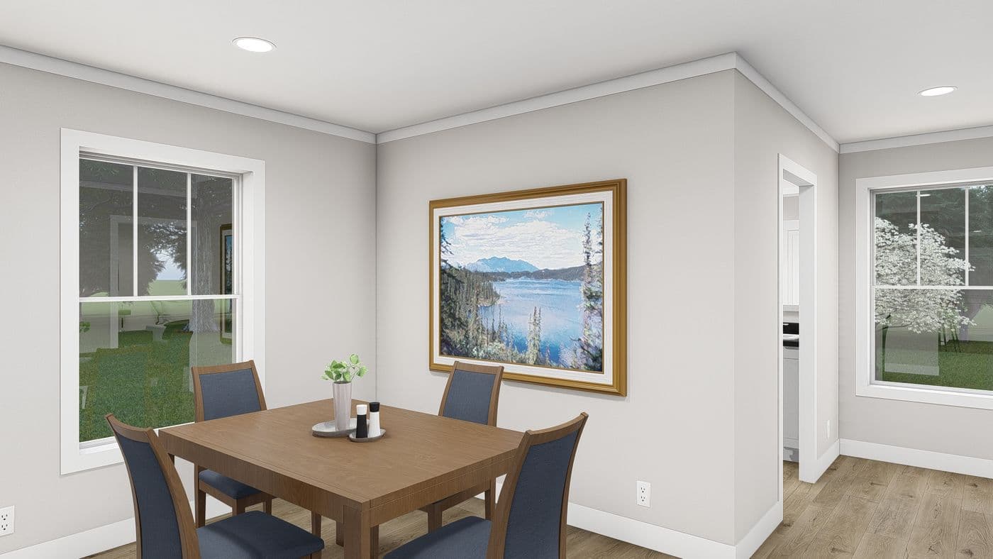 The LET IT BE Dining Area. This Manufactured Mobile Home features 3 bedrooms and 2 baths.