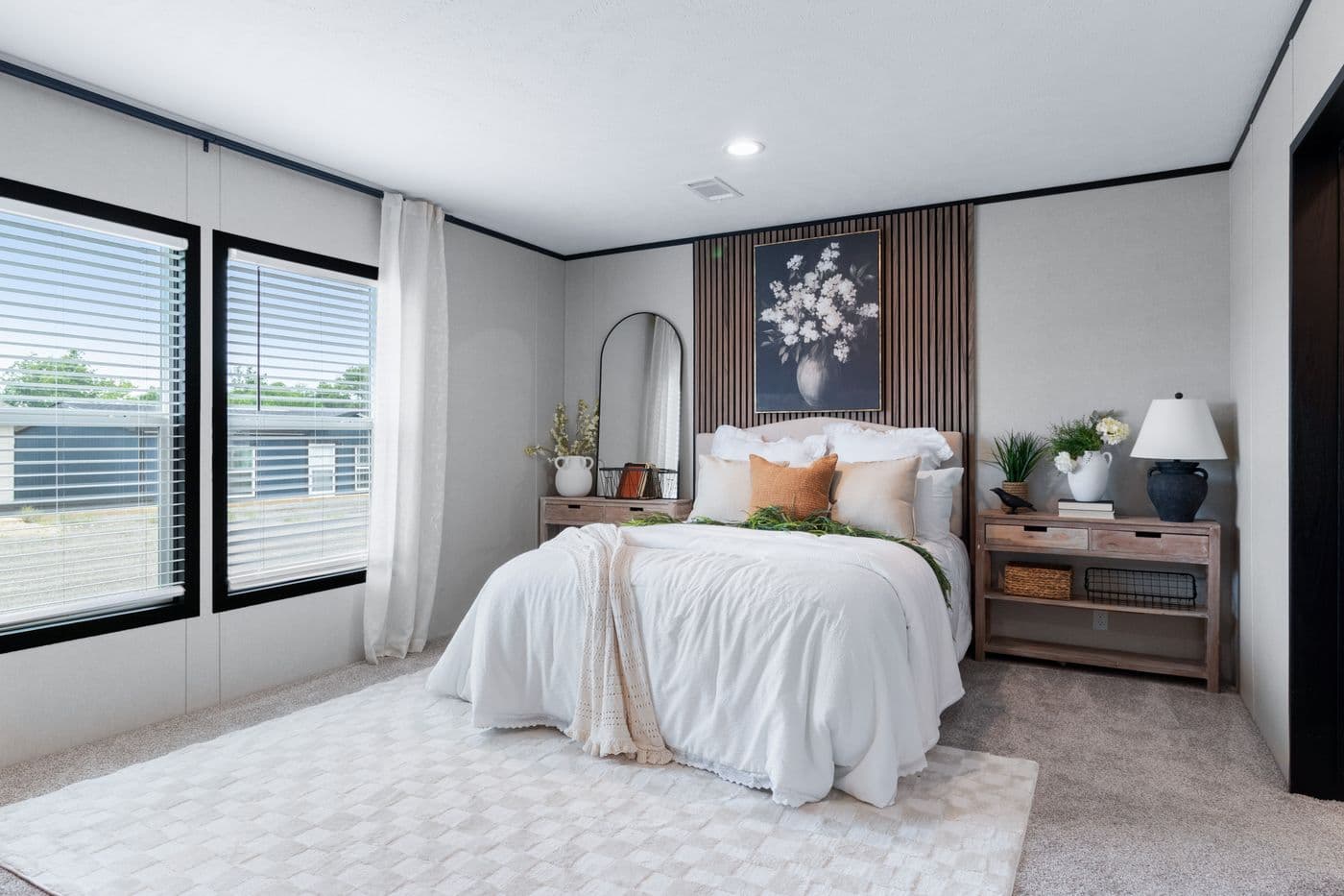 The ABSOLUTE VALUE Primary Bedroom. This Manufactured Mobile Home features 4 bedrooms and 2 baths.