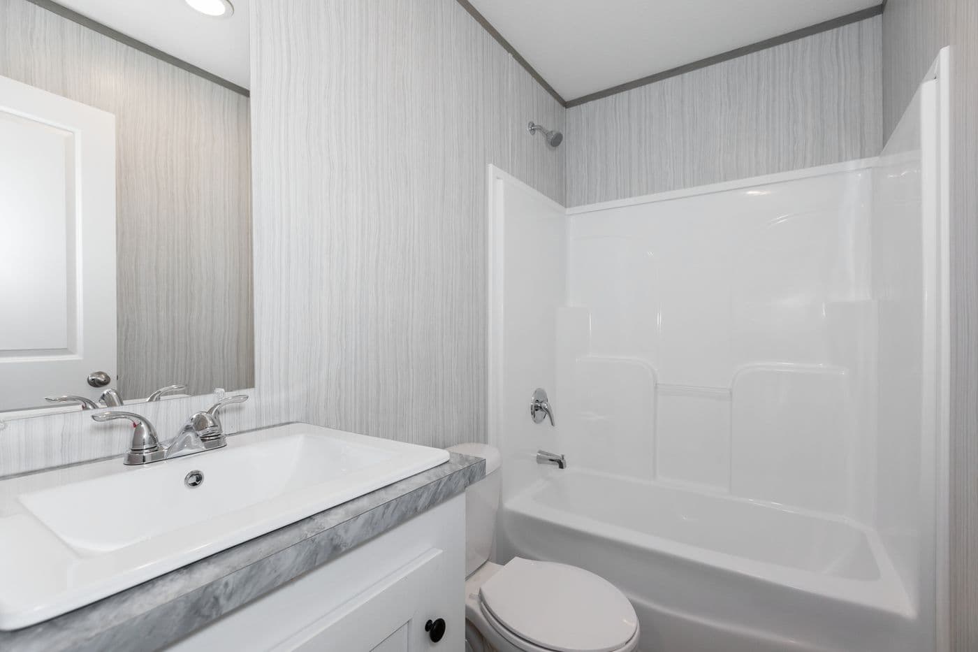 The THE ULTIMATE SHOWER Guest Bathroom. This Manufactured Mobile Home features 3 bedrooms and 2 baths.