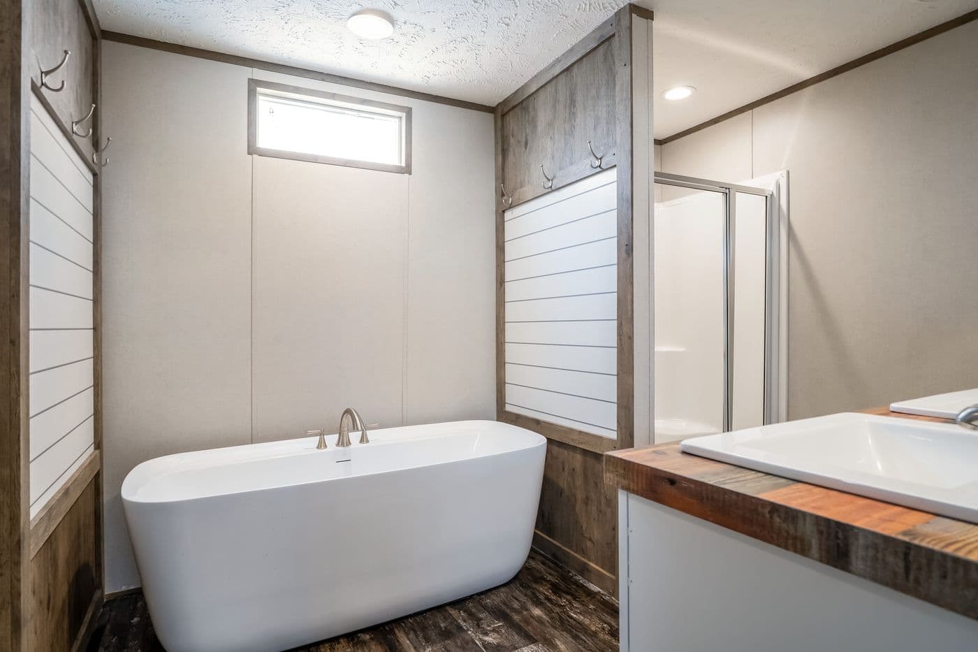 The ANNIVERSARY ENTERTAINER Exterior. This Manufactured Mobile Home features 3 bedrooms and 2 baths.