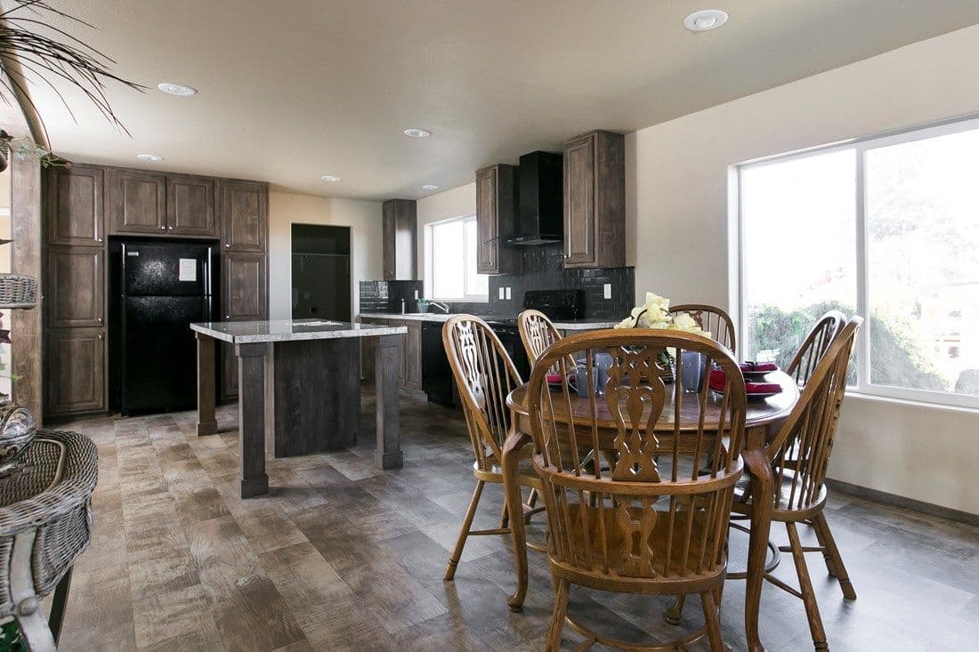 The 2022 COLUMBIA RIVER (NEW) Dining Area. This Manufactured Mobile Home features 3 bedrooms and 2 baths.